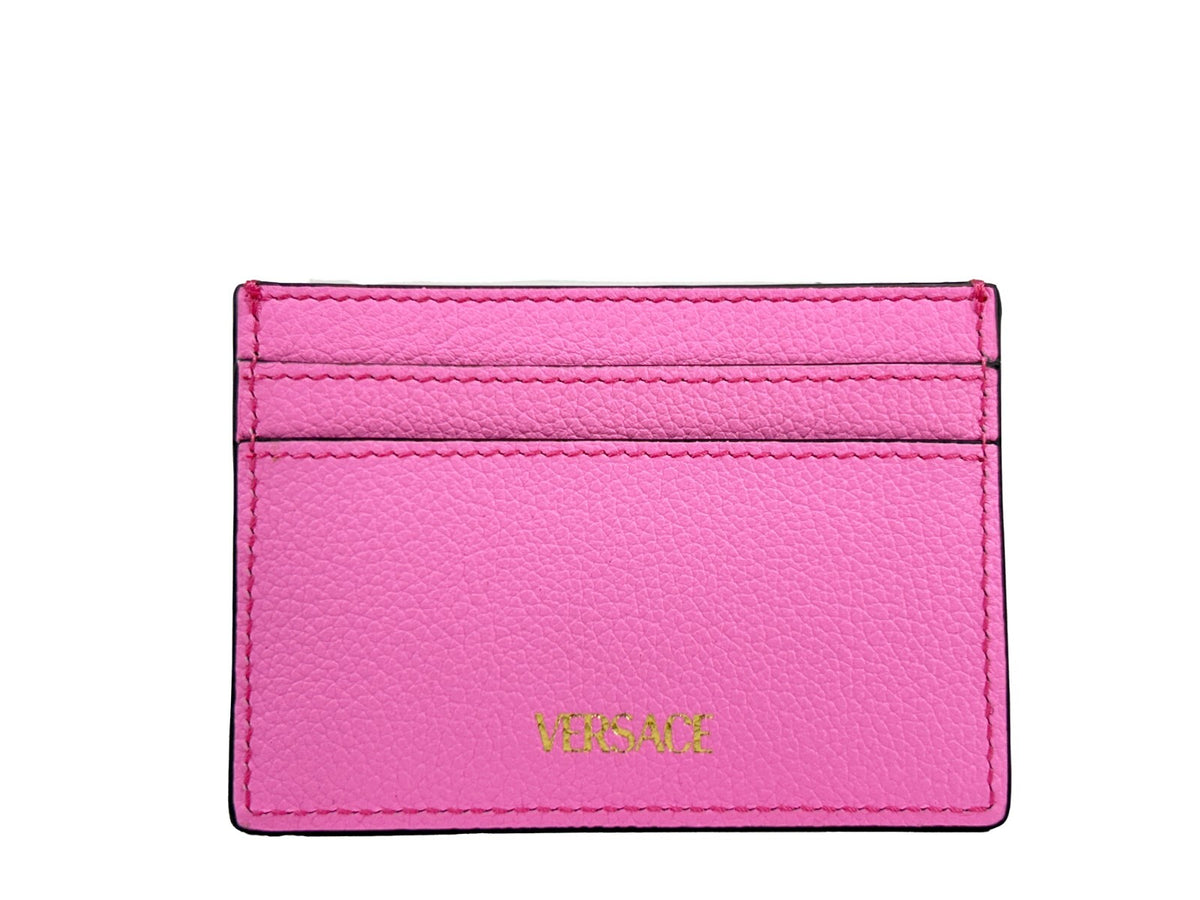 Indulge in the Versace Mini Medusa Pink Grainy Leather Slim Card Case Wallet, a testament to exquisite craftsmanship and modern elegance, perfect for the discerning individual.