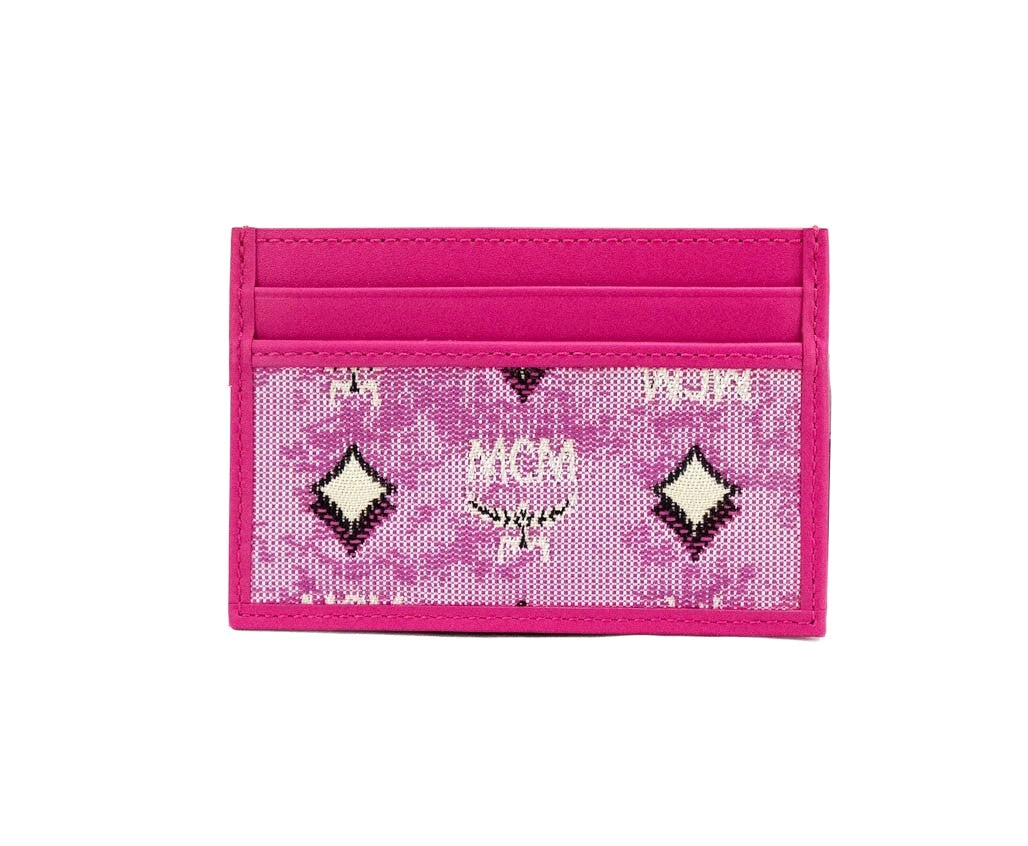 Elevate your style with the MCM Veritas Vintage Pink Denim Card Case Wallet, a masterpiece of exquisite craftsmanship and timeless elegance, perfect for the discerning individual.