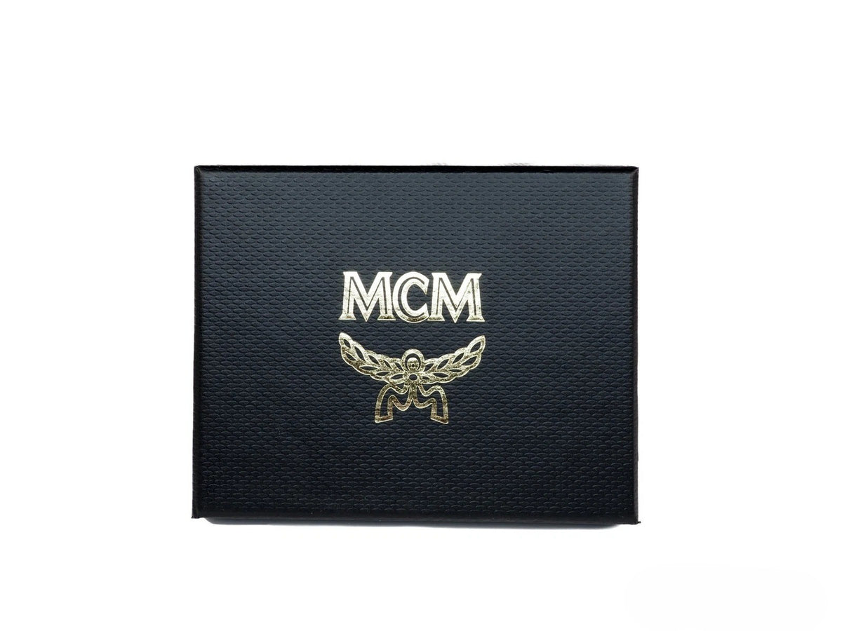 Indulge in the exquisite MCM Neon Yellow Visetos Diamond Logo Card Case, a luxurious blend of coated canvas and nappa leather, elevating your style with timeless elegance.