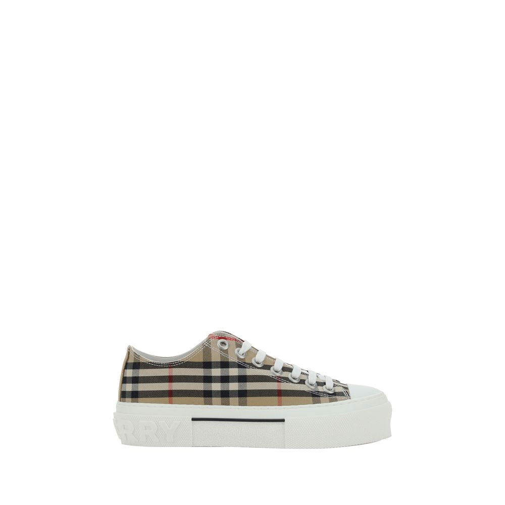 Indulge in the Burberry Brown Synthetic Low Top Sneakers, where exquisite craftsmanship meets timeless elegance, perfect for elevating any sophisticated ensemble.
