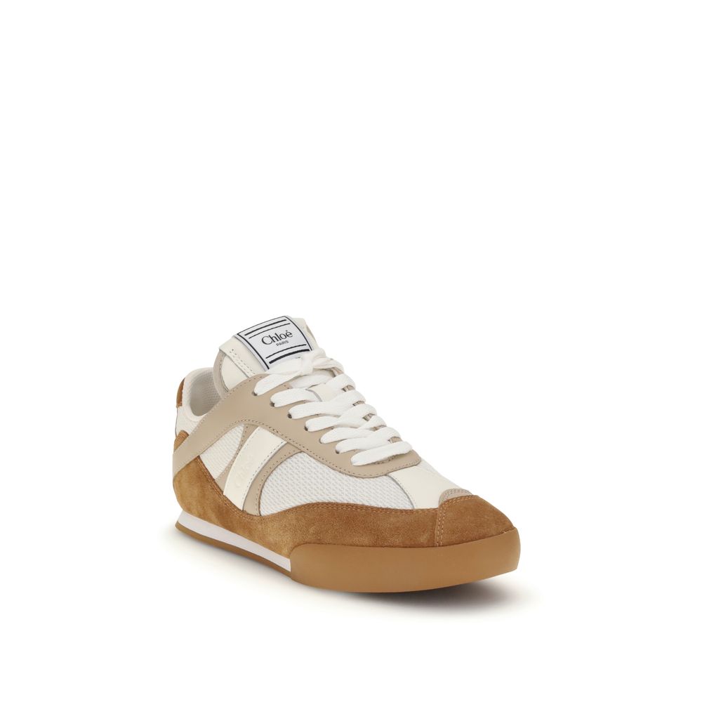 Step into unparalleled elegance with Chloé Brown Rubber Athletic Sneakers, where luxurious calfskin meets sustainable design, perfect for the discerning individual.
