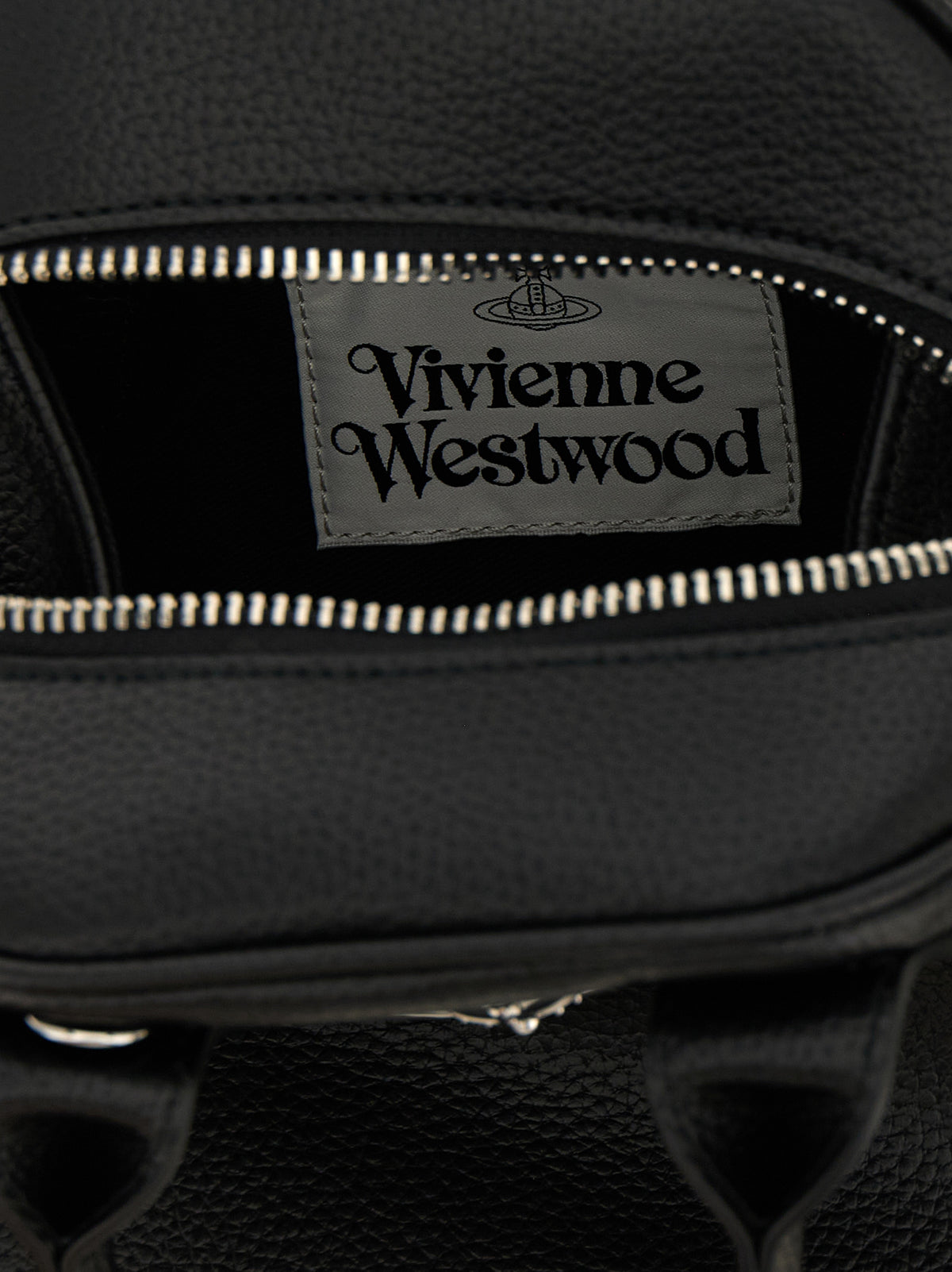 Indulge in the exquisite Vivienne Westwood Small PU ‘Yasmine’ handbag, a masterpiece of Italian craftsmanship that redefines luxury and elegance for discerning tastes.