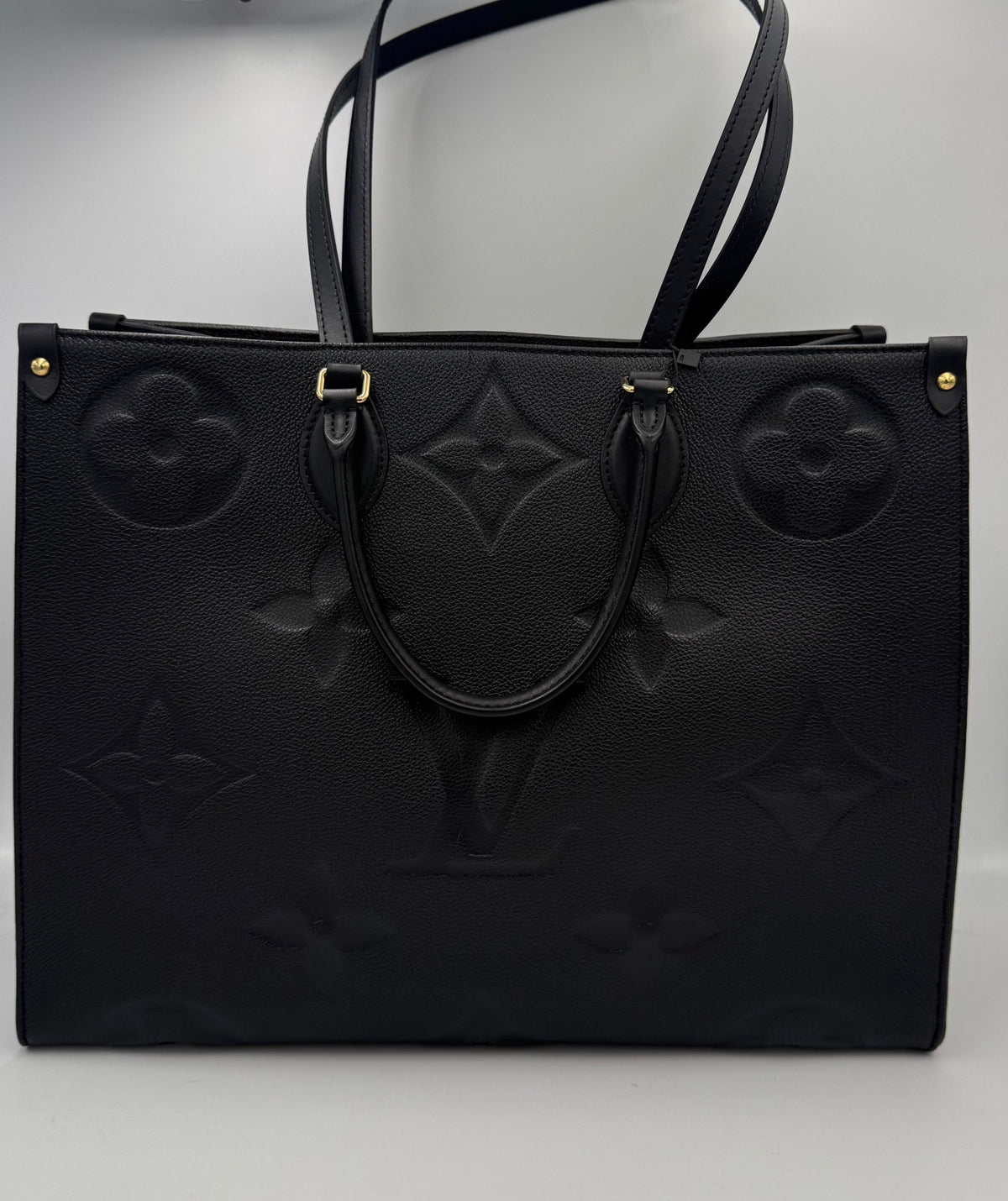 Elevate your style with the Louis Vuitton ON THE GO Empreinte GM Handbag, a luxurious blend of exquisite craftsmanship and timeless elegance, perfect for discerning individuals.