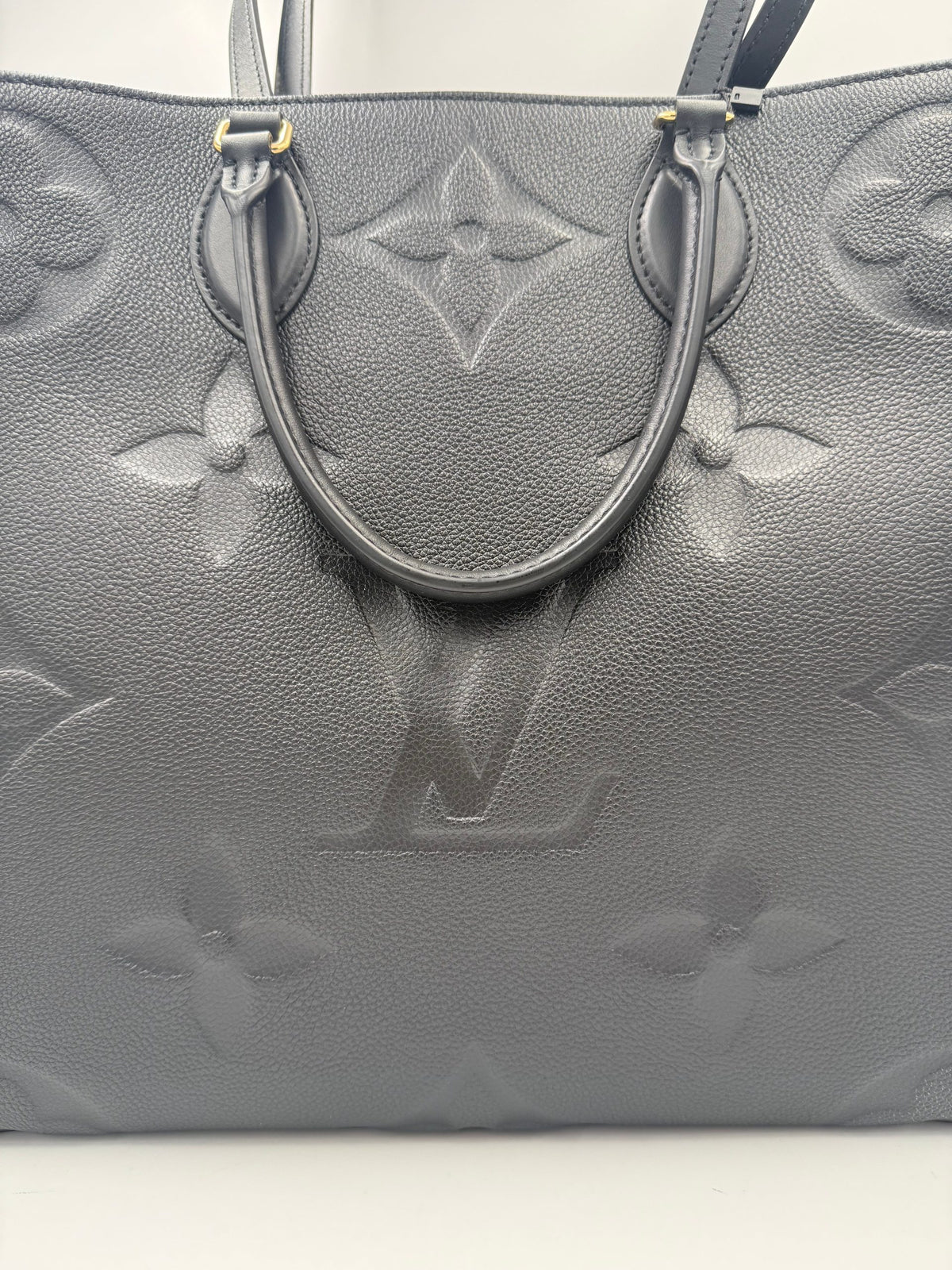 Elevate your style with the Louis Vuitton ON THE GO Empreinte GM Handbag, a timeless masterpiece of exquisite craftsmanship and luxurious design, perfect for any occasion.
