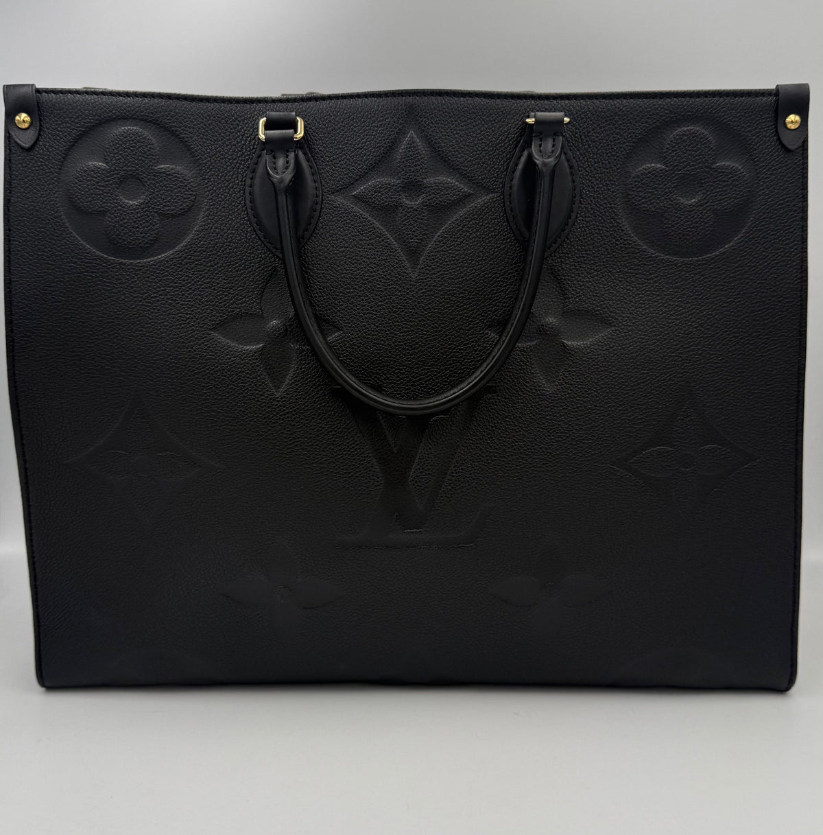 Elevate your style with the Louis Vuitton ON THE GO Empreinte GM Handbag, a luxurious blend of exquisite craftsmanship and timeless elegance, perfect for discerning individuals.