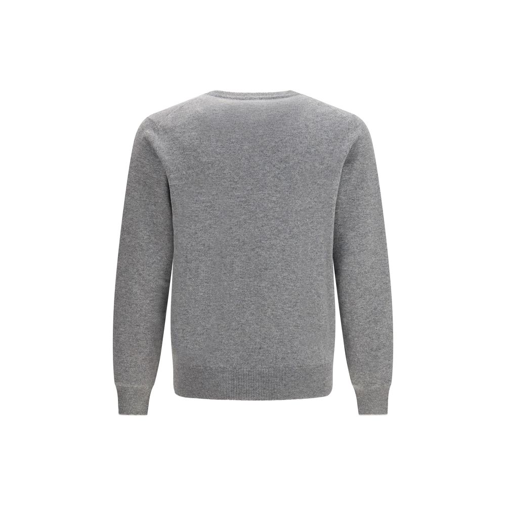 Experience the exquisite allure of the Brunello Cucinelli Gray Cashmere Sweater, crafted from the finest cashmere for timeless elegance and unparalleled comfort.