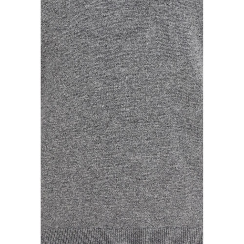 Elevate your wardrobe with the Brunello Cucinelli Gray Cashmere Sweater, a timeless piece crafted from the finest cashmere, embodying sophistication and luxury for every occasion.