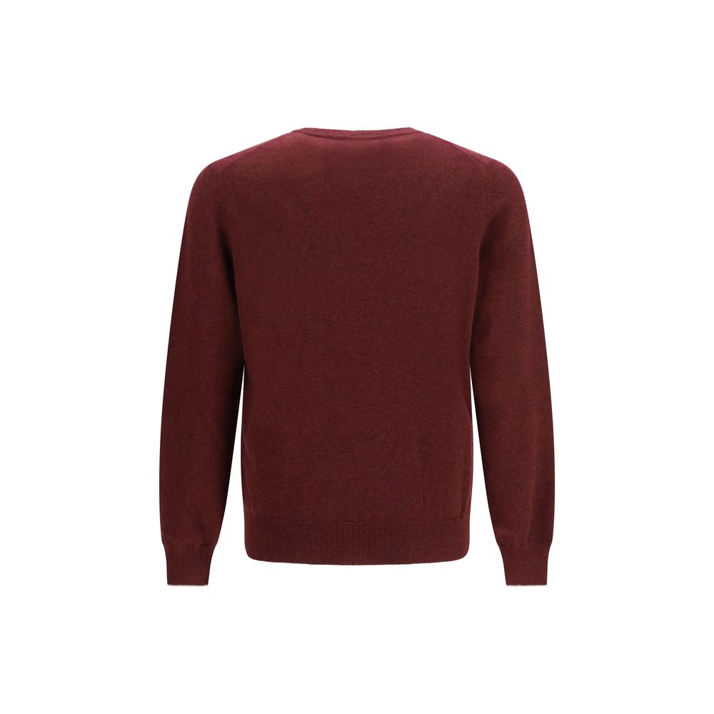 Indulge in the exquisite Brunello Cucinelli Bordeaux Cashmere Sweater, a masterpiece of luxury craftsmanship that envelops you in warmth and sophistication for any occasion.