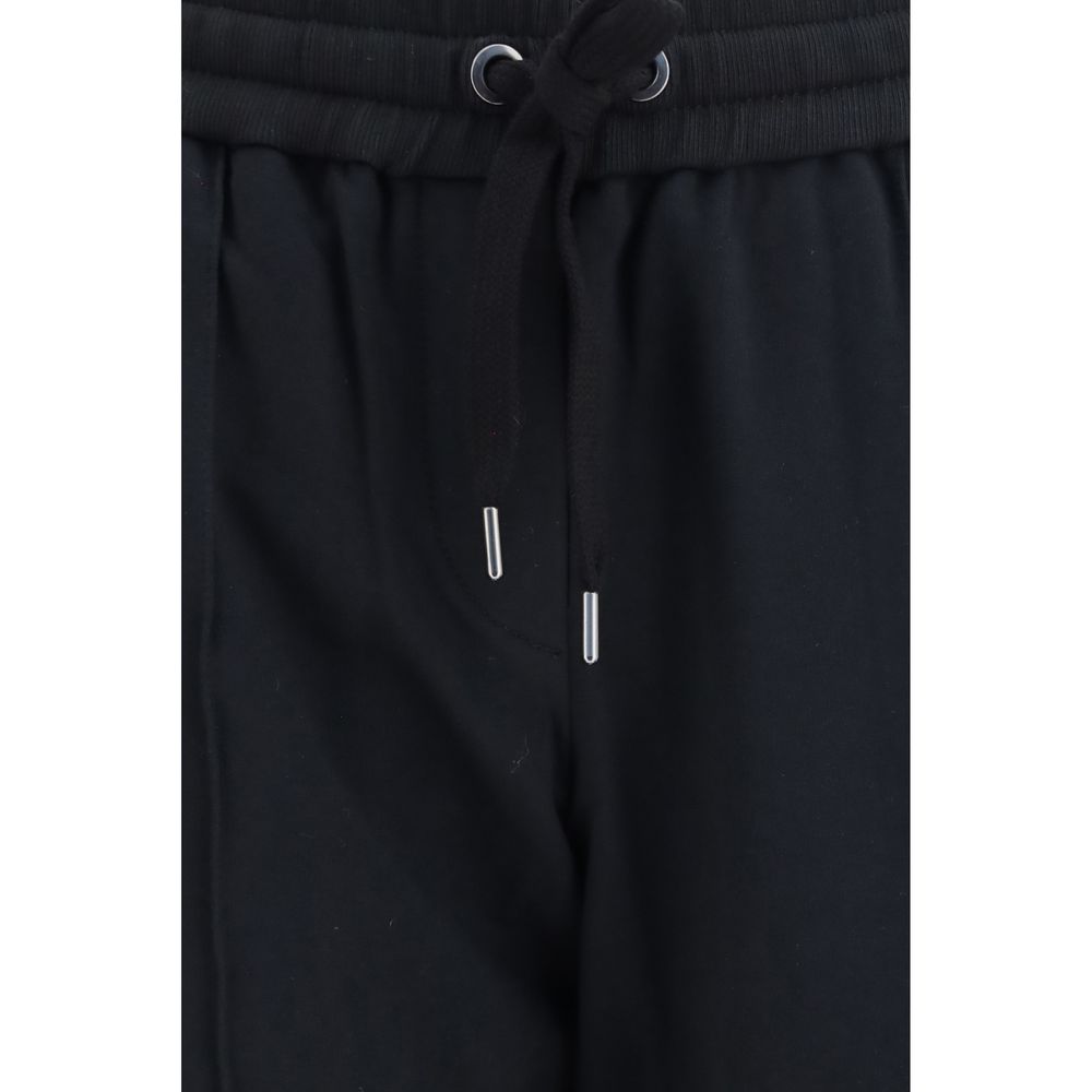 Indulge in the refined elegance of Brunello Cucinelli Black Cotton Athletic Pants, crafted from a luxurious cotton blend, perfect for the discerning individual who values style and comfort.