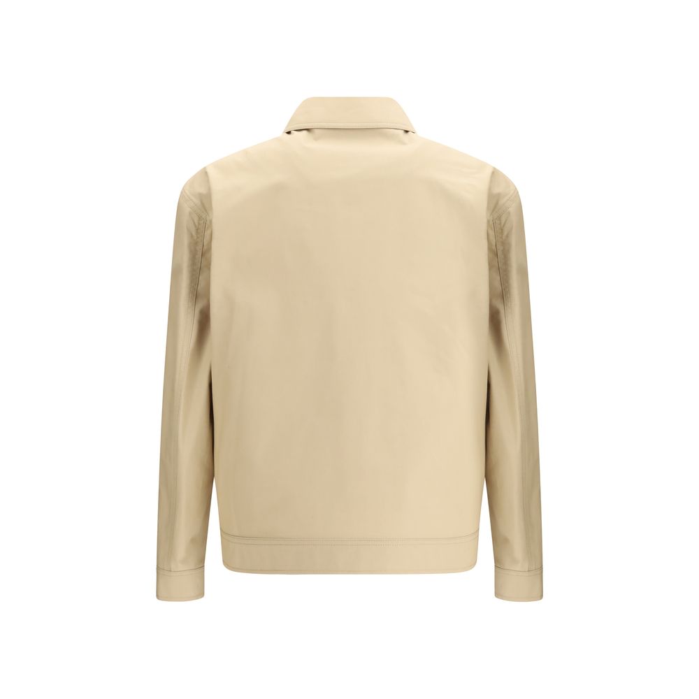 Elevate your wardrobe with the Moschino Beige Cotton Full-Length Jacket, a masterpiece of contemporary elegance crafted from 100% cotton for unparalleled luxury and comfort.