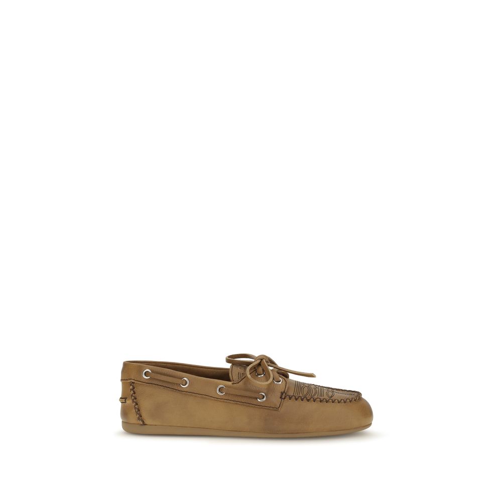 Indulge in the exquisite Miu Miu Beige Calf Leather Bos Taurus Slip-On Loafers, where luxurious craftsmanship meets timeless elegance for the discerning connoisseur.