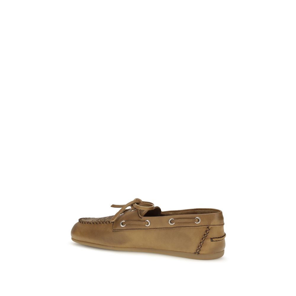 Discover the Miu Miu Beige Calf Leather Bos Taurus Slip-On Loafers, where exquisite craftsmanship meets timeless elegance, perfect for the discerning connoisseur.
