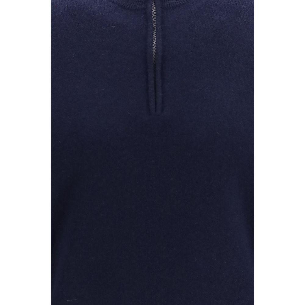 Elevate your wardrobe with the Brunello Cucinelli Blue Cashmere Sweater, a masterpiece of exquisite craftsmanship and timeless luxury, perfect for any discerning individual.