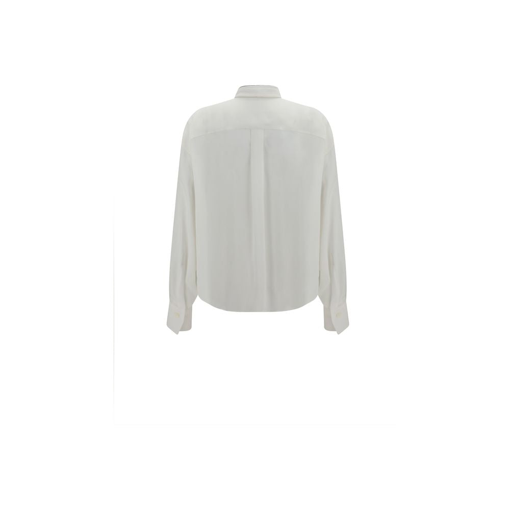 Elevate your wardrobe with the Brunello Cucinelli White Silk Dress Shirt, a masterpiece of 100% silk craftsmanship, embodying timeless elegance and sophisticated allure.