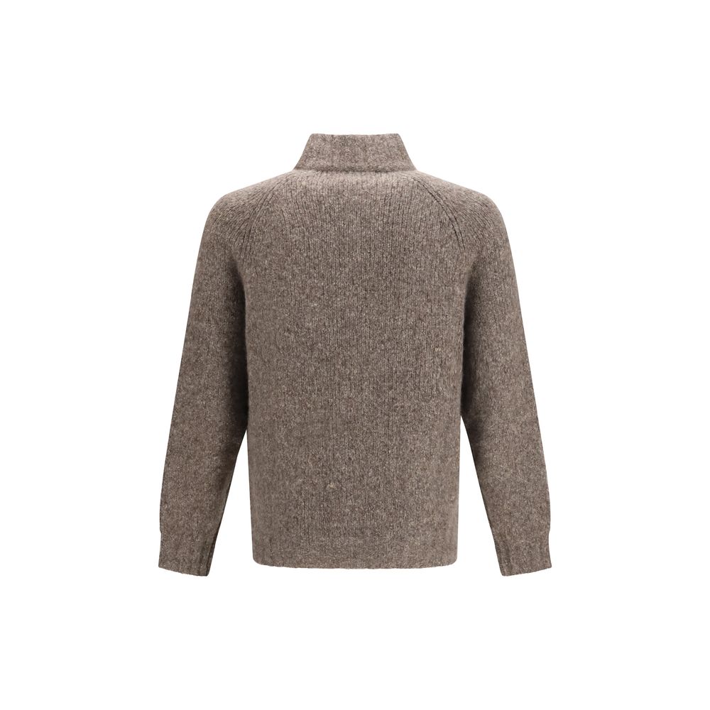 Experience the exquisite allure of the Brunello Cucinelli Beige Cashmere Cardigan, a luxurious blend of cashmere and silk that embodies timeless sophistication and refined elegance.