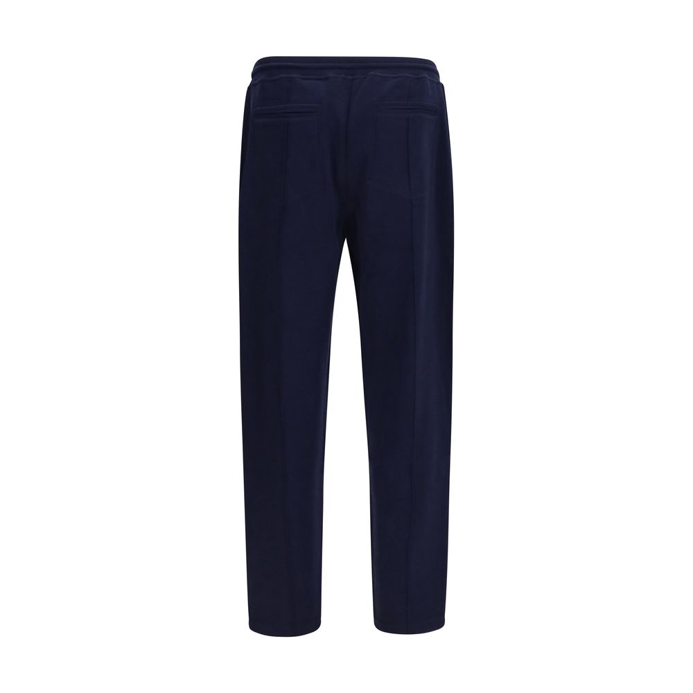 Elevate your wardrobe with Brunello Cucinelli's Blue Cotton Athletic Pants, a luxurious blend of cotton and cashmere, embodying sophistication and tailored elegance for the discerning individual.