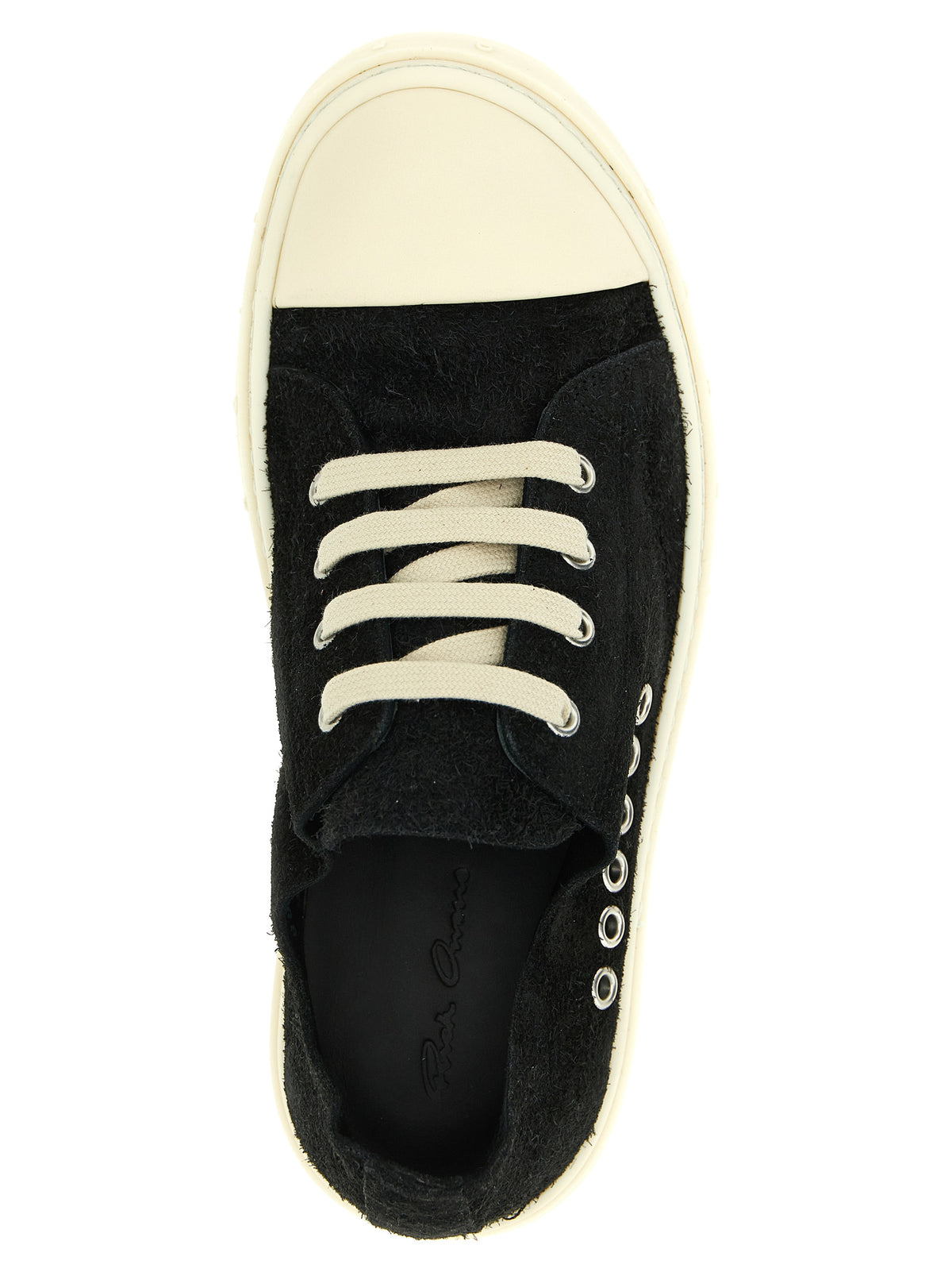 Step into a realm of sophistication with Rick Owens' Black Calfskin Low Top Sneakers, where architectural elegance and luxurious craftsmanship redefine street-style allure.