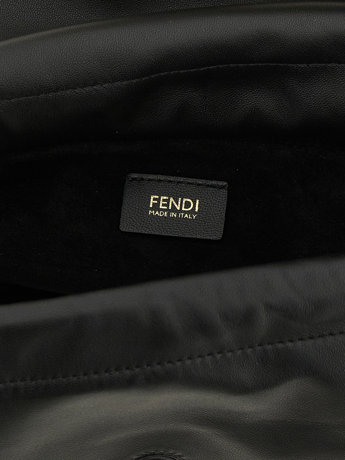 Indulge in the Fendi Baguette® Soft Media handbag, a luxurious black nappa leather masterpiece, exuding timeless elegance and unparalleled craftsmanship for the discerning individual.