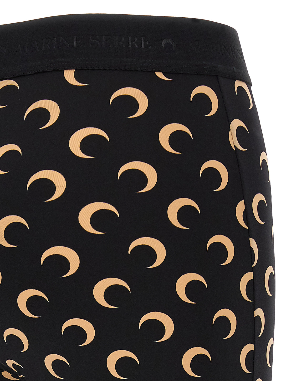 Indulge in the elegance of Marine Serre's Beige Polyamide Leggings, crafted from recycled materials, merging sustainability with chic sophistication for the discerning fashion connoisseur.