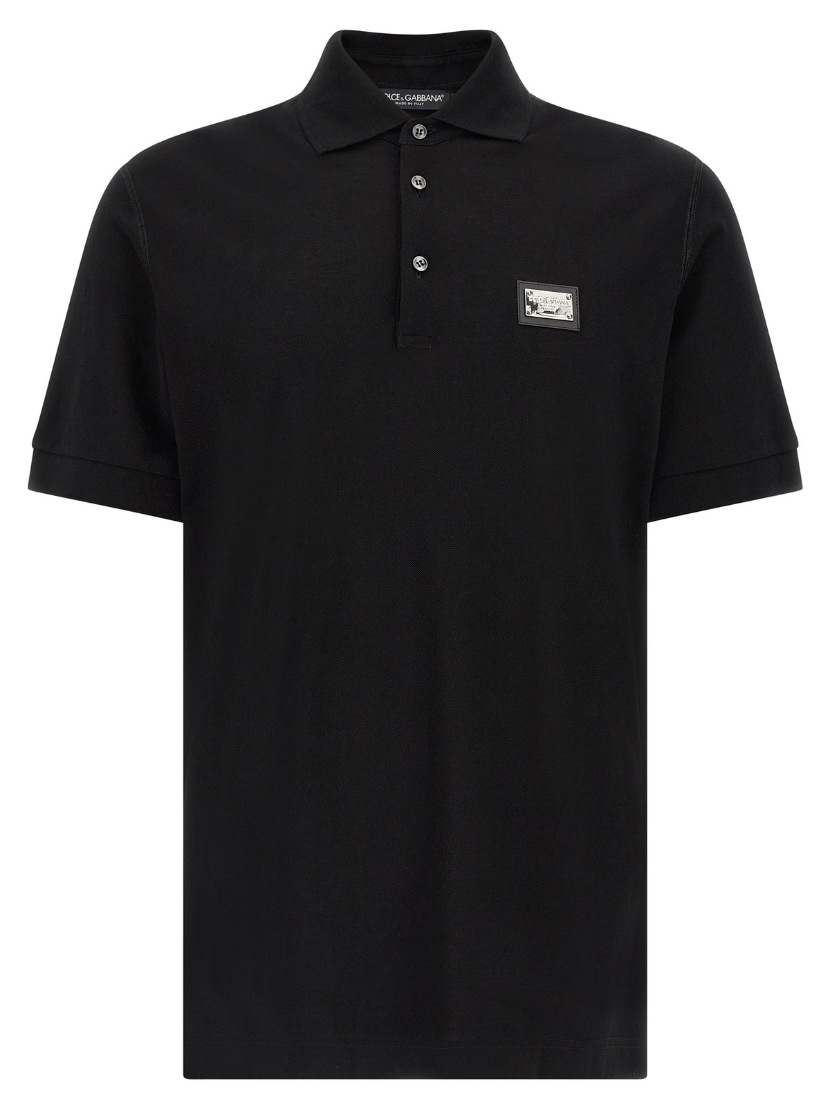 Indulge in the exquisite Dolce & Gabbana Black Cotton Polo Shirt, crafted from premium Italian cotton, embodying timeless elegance and sophisticated allure for the discerning individual.