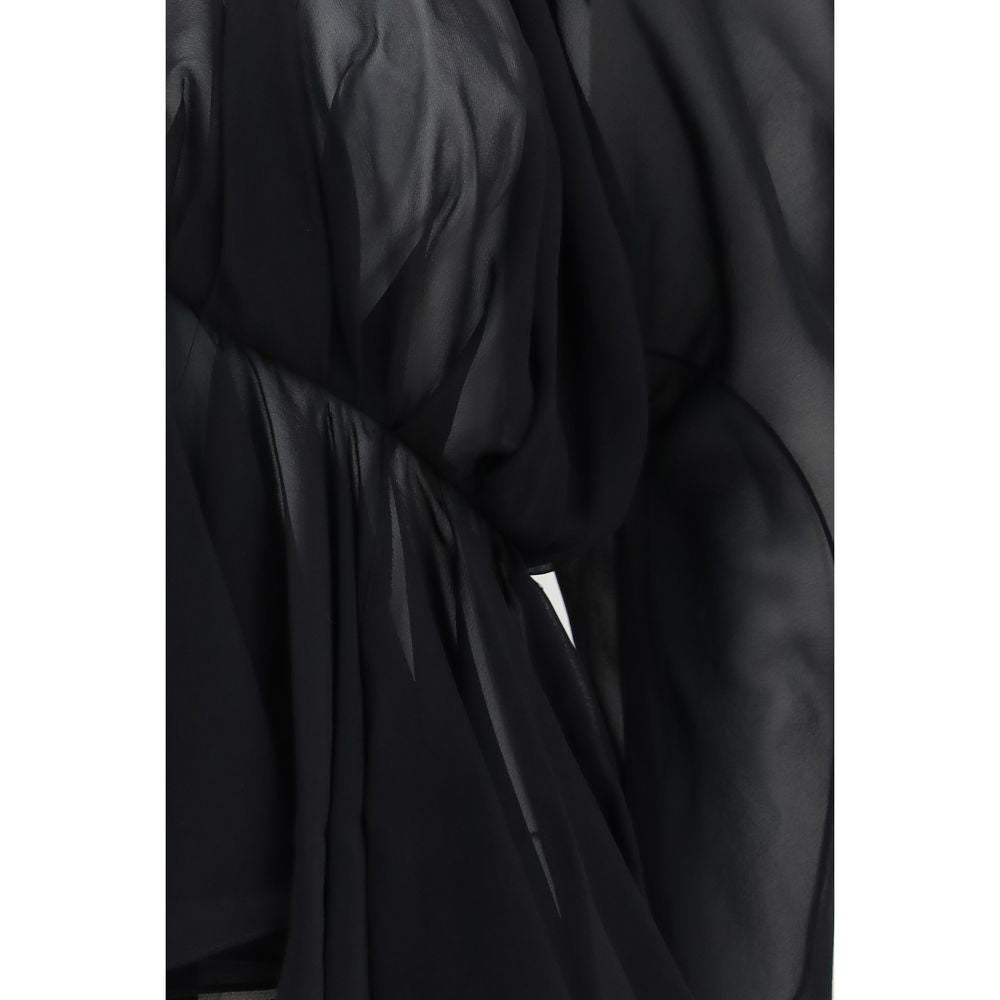Indulge in the Khaite Black Silk Blouse, a masterpiece of lightweight silk chiffon, exuding elegance with its draped design and refined sophistication for every occasion.