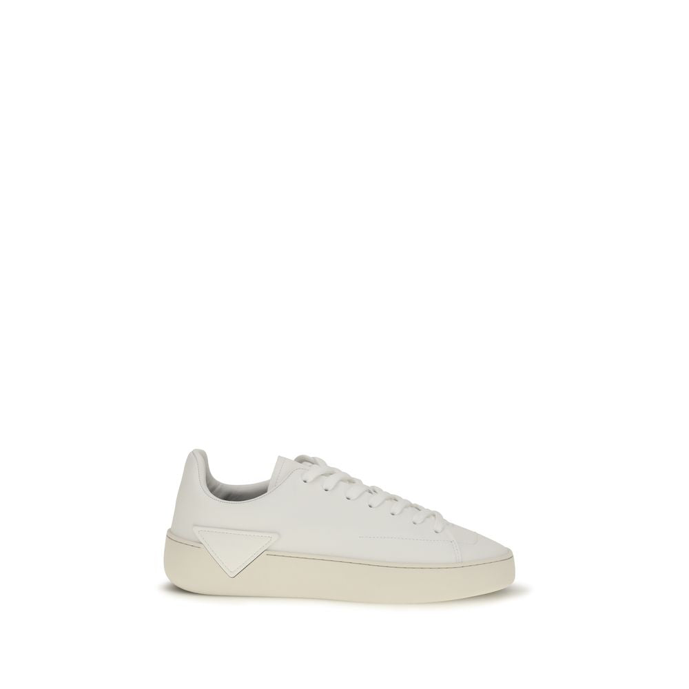 Discover the Prada White Calf Leather Bos Taurus Low Top Sneakers, where exquisite craftsmanship meets timeless elegance, perfect for the discerning individual.