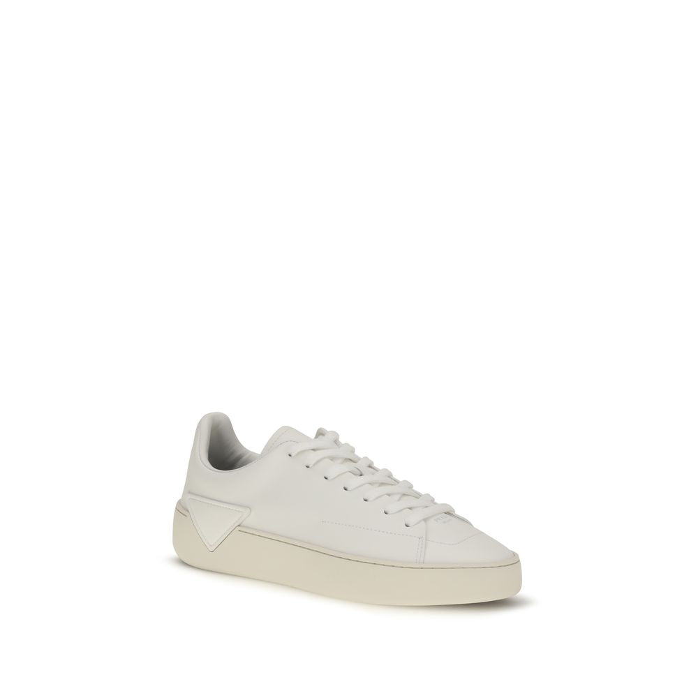 Indulge in the refined elegance of Prada's White Calf Leather Bos Taurus Low Top Sneakers, where impeccable craftsmanship meets contemporary luxury for a timeless statement.
