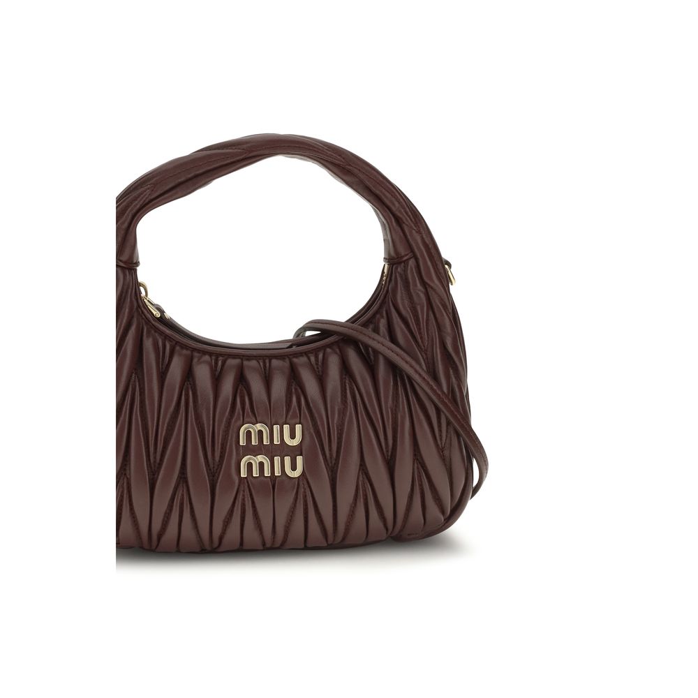Elevate your style with the Miu Miu Bordeaux Calf Leather Bos Taurus Shoulder Bag, a masterpiece of exquisite craftsmanship and timeless elegance, perfect for the discerning connoisseur.