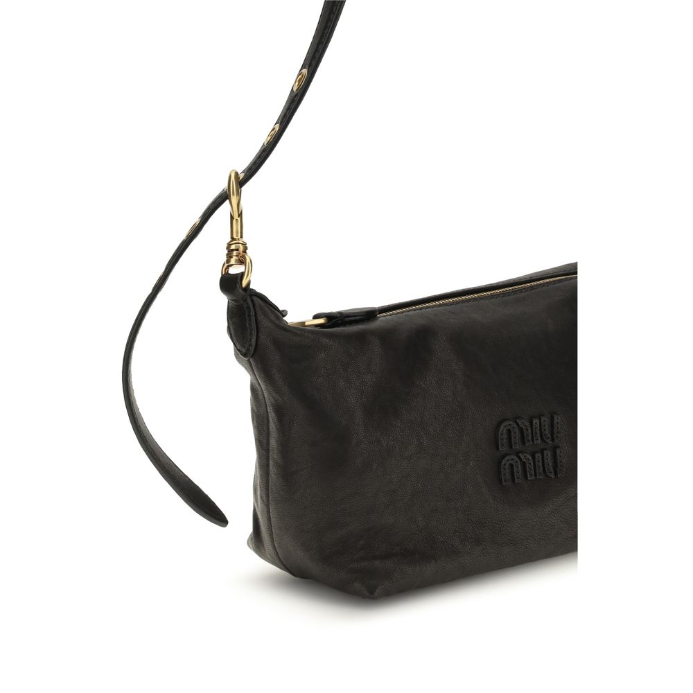 Discover the Miu Miu Black Suede Leather Shoulder Bag, a masterpiece of craftsmanship in sumptuous suede, embodying timeless elegance for the discerning individual.
