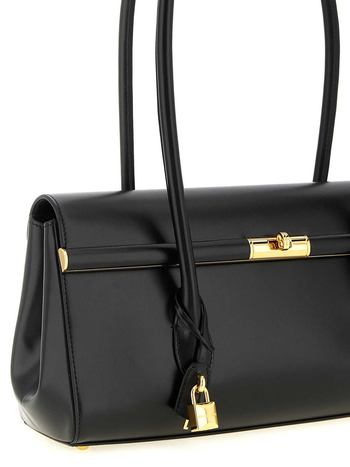 Elevate your style with the Dolce & Gabbana Marlene handbag, a timeless black calfskin masterpiece that embodies Italian craftsmanship and luxurious sophistication.