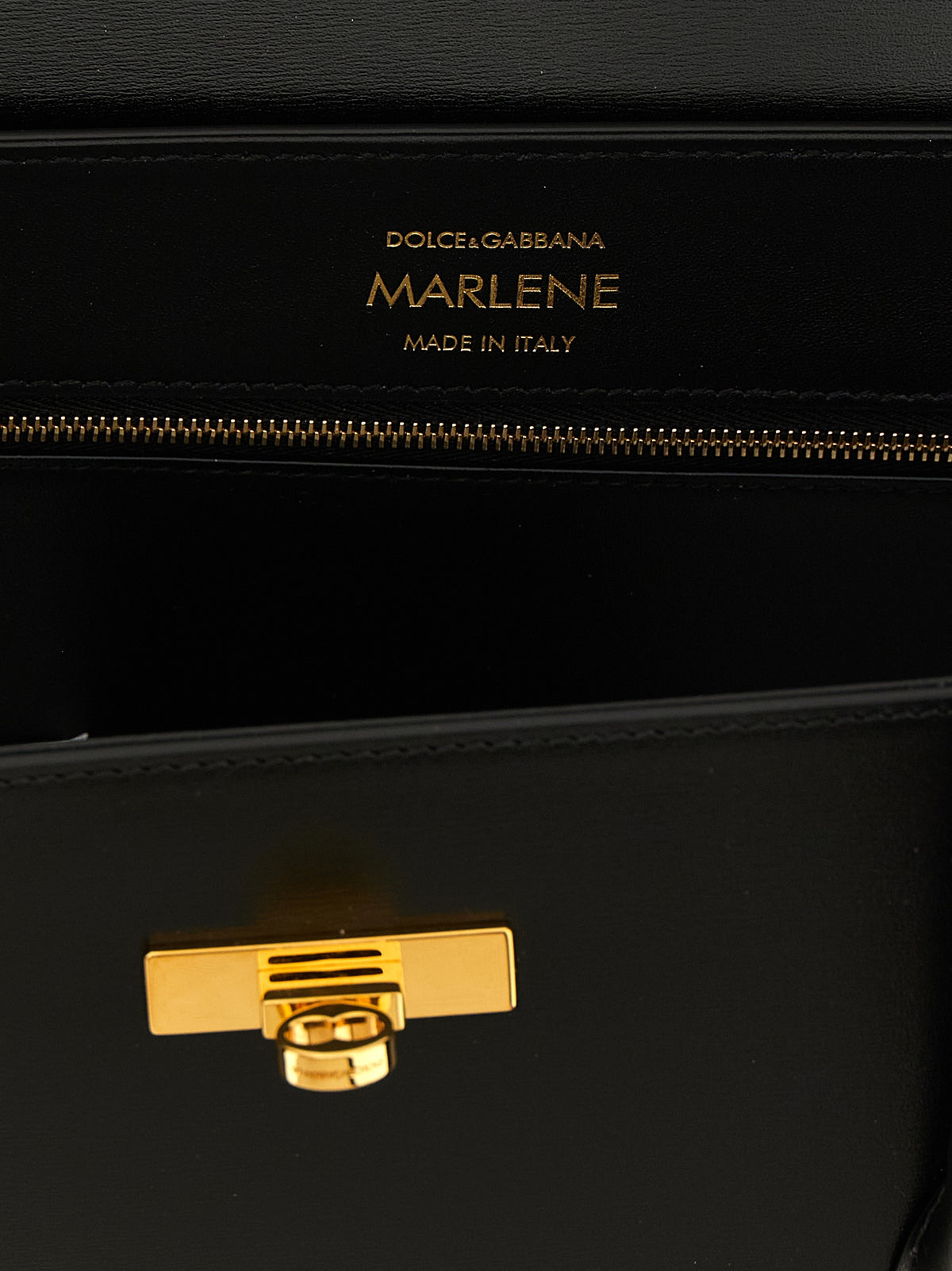 Indulge in the exquisite craftsmanship of the Dolce & Gabbana Marlene handbag, a timeless symbol of luxury and sophistication, perfect for the discerning connoisseur.