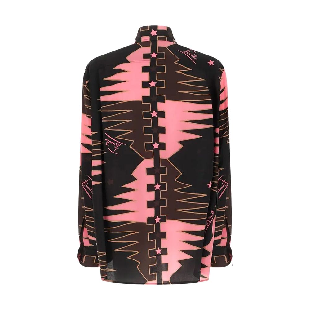 Elevate your wardrobe with the Emilio Pucci Valdimontone Print Oversized Silk Shirt, a luxurious blend of silk crêpe de Chine and exquisite artistry, perfect for the discerning individual.