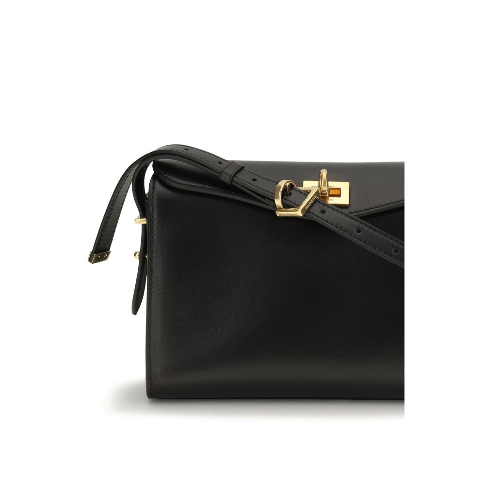 Indulge in the exquisite craftsmanship of the Balenciaga Black Lamb Ovis Aries Shoulder Bag, a timeless accessory that redefines luxury and sophistication for the discerning individual.