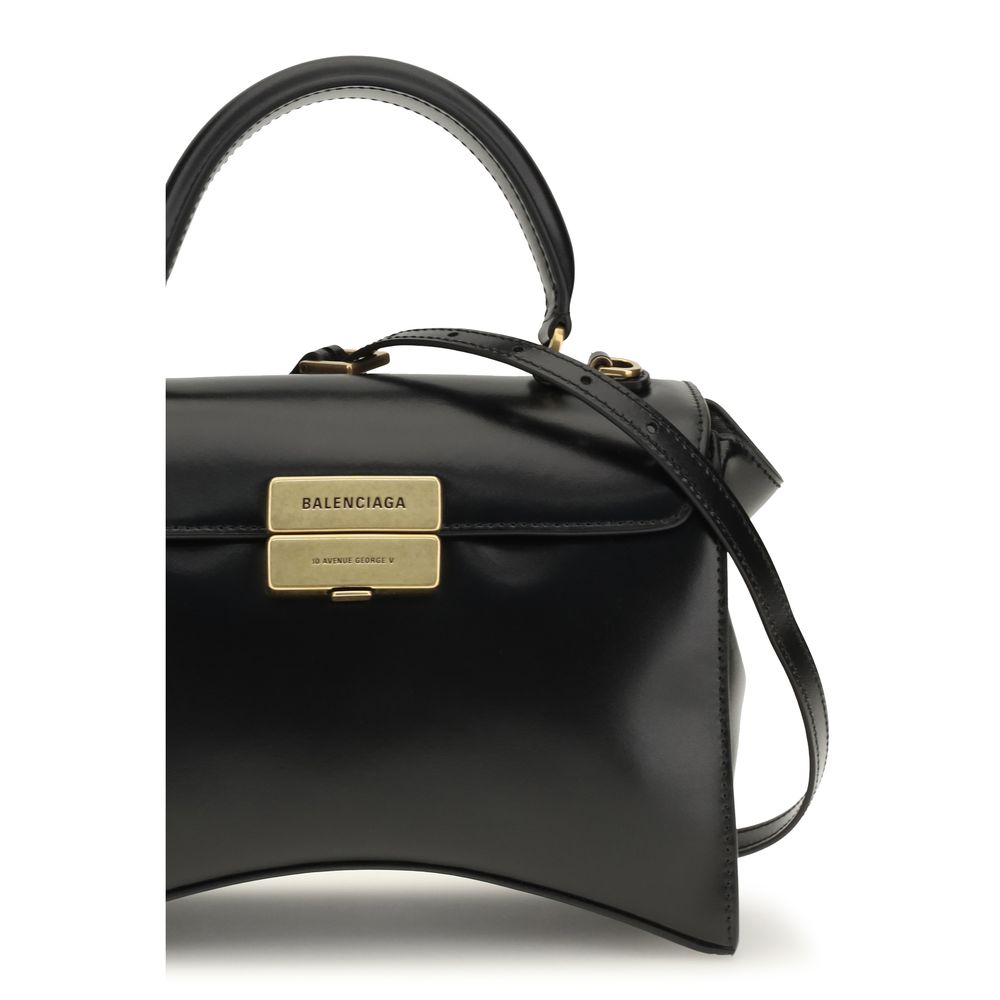 Indulge in the Balenciaga Black Calf Leather Bos Taurus Shoulder Bag, a symbol of exquisite craftsmanship and timeless elegance, perfect for the discerning connoisseur.