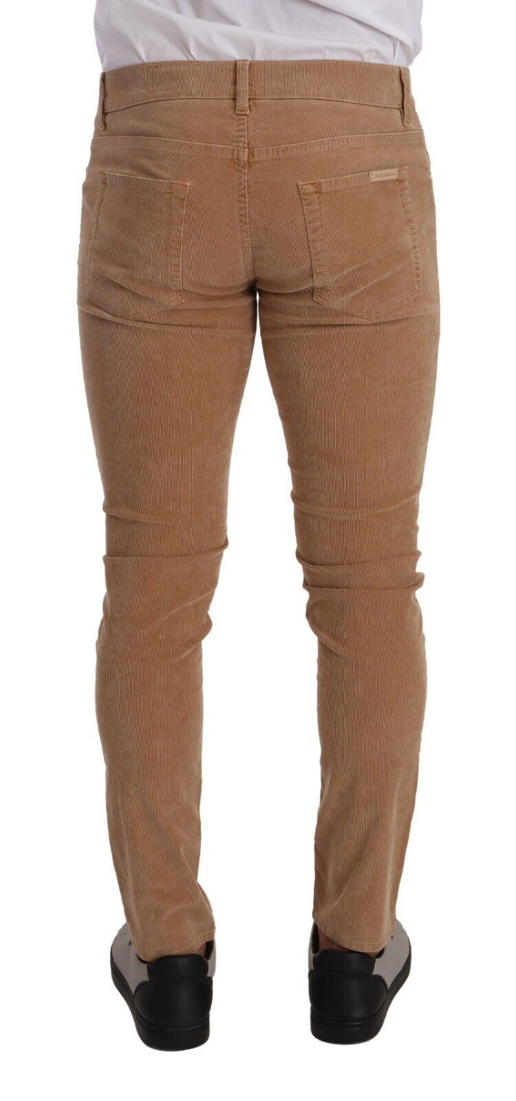Indulge in the luxurious allure of Dolce & Gabbana's Brown Corduroy Cotton Skinny Slim Fit Jeans, where exquisite craftsmanship meets sophisticated style for the discerning individual.