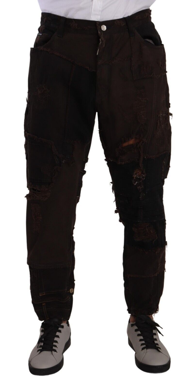 Elevate your wardrobe with Dolce & Gabbana's Brown Cotton Distressed Denim Jeans, a luxurious blend of comfort and artistry, perfect for the discerning individual.
