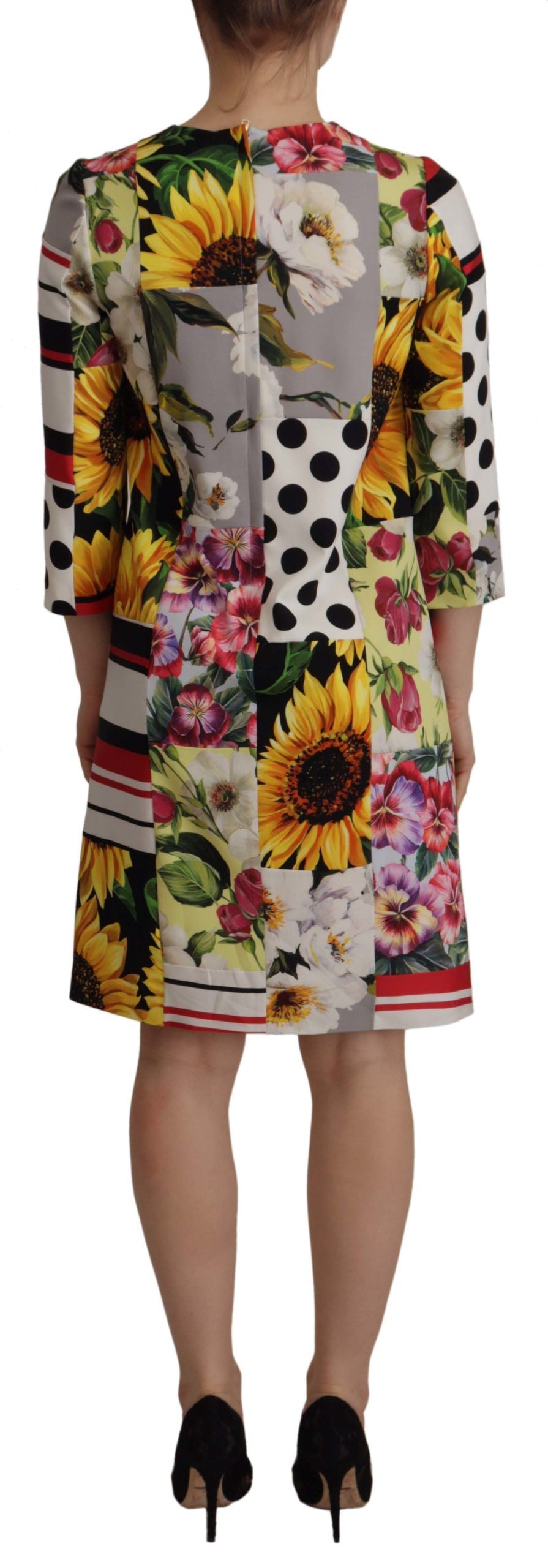 Indulge in the exquisite Dolce & Gabbana Multicolor Charmeuse Floral Sheath Dress, where luxurious charmeuse and intricate patchwork redefine timeless elegance for the discerning individual.