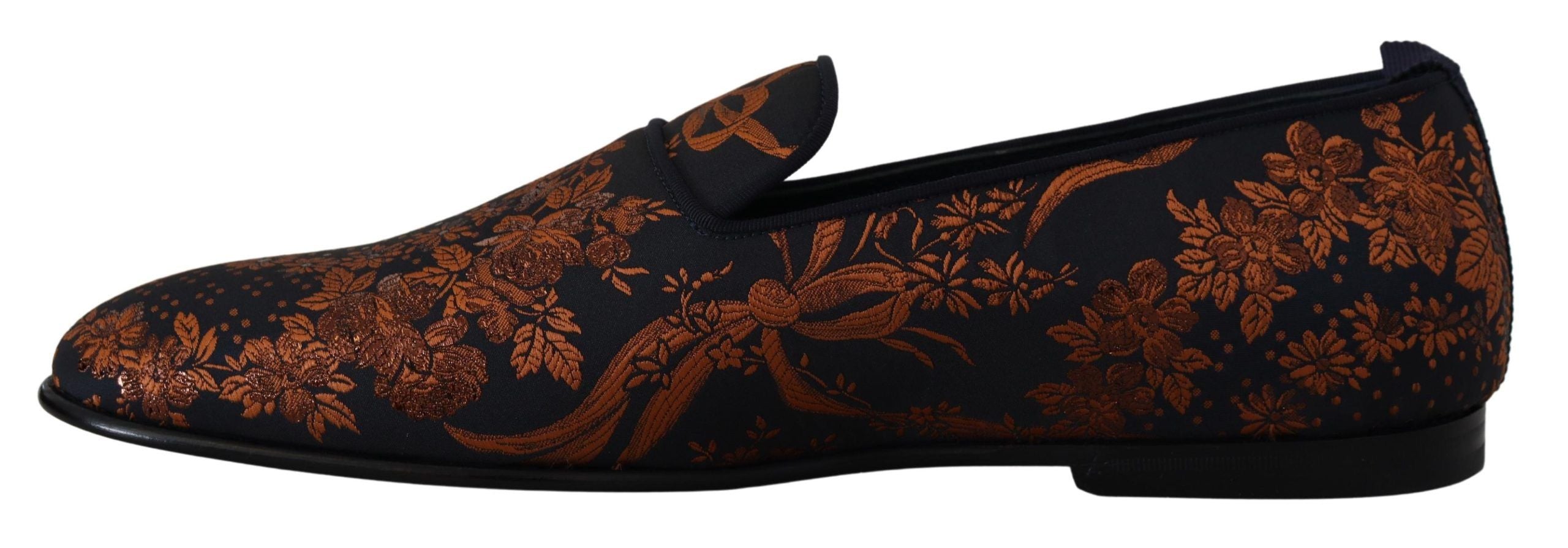 Experience the exquisite Dolce & Gabbana Blue Rust Floral Slippers, where luxurious craftsmanship meets captivating design, perfect for the discerning individual.