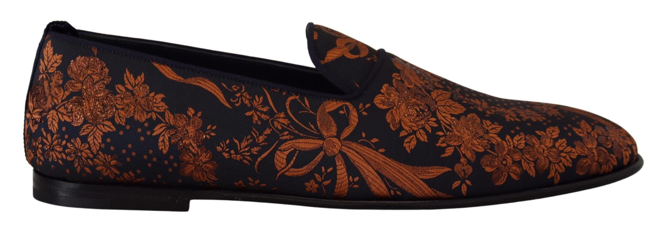 Indulge in the exquisite Dolce & Gabbana Blue Rust Floral Slippers, where luxurious craftsmanship meets Italian elegance, perfect for the discerning individual.