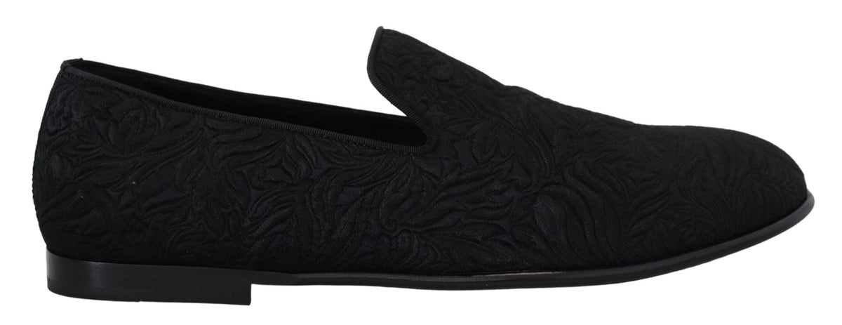 Indulge in the exquisite Dolce & Gabbana Black Floral Jacquard Slippers, handcrafted in Italy with luxurious materials for timeless elegance and effortless sophistication.