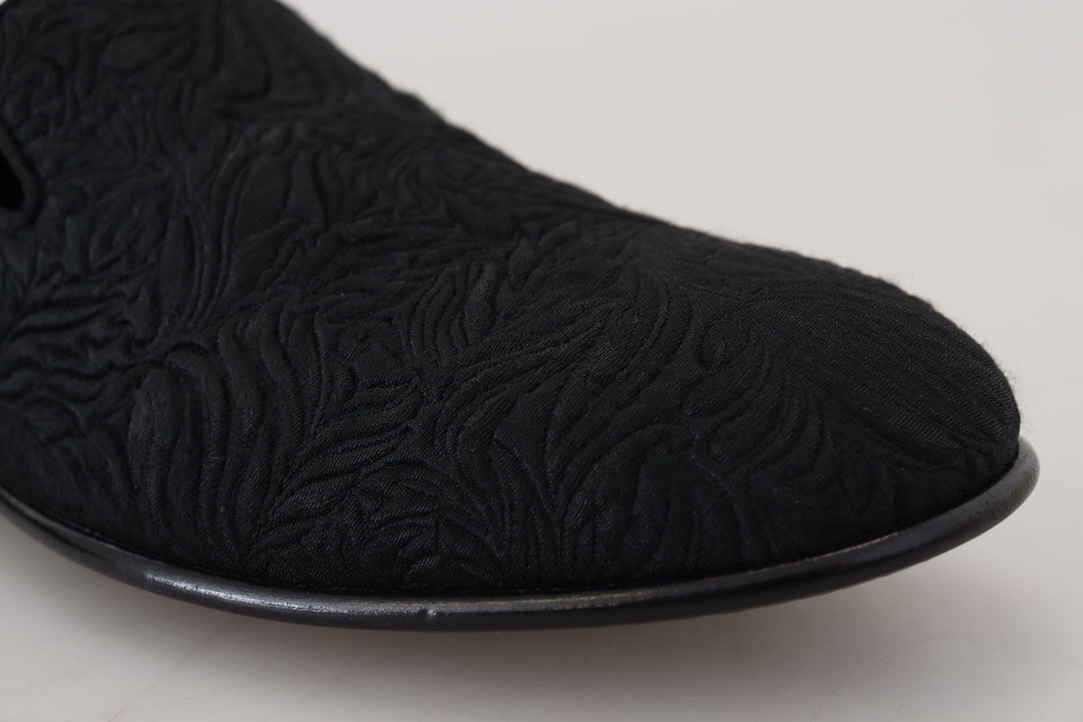Indulge in the exquisite Dolce & Gabbana Black Floral Jacquard Slippers, handcrafted in Italy for timeless elegance and effortless sophistication, elevating your luxury wardrobe.