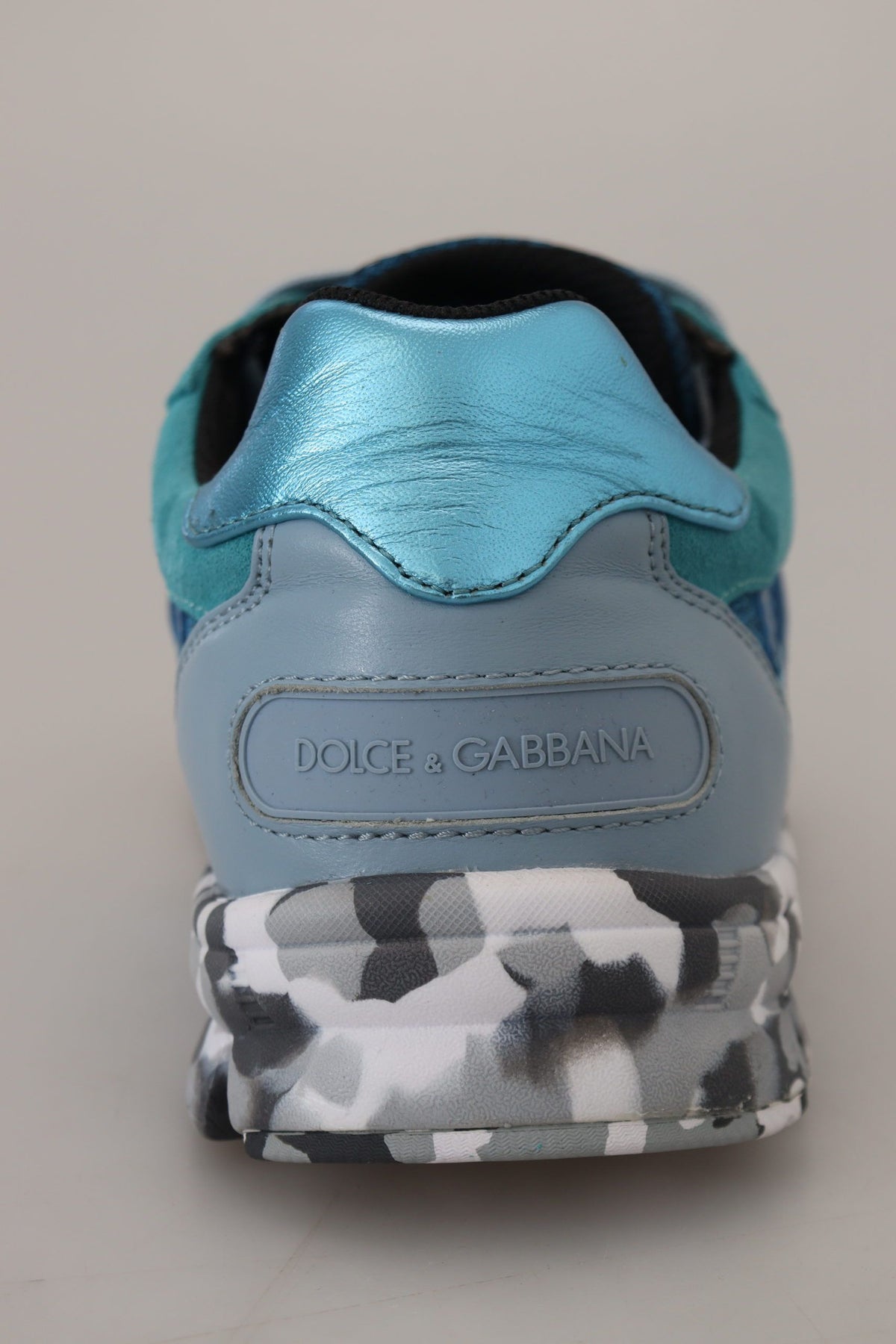 Indulge in the exquisite Dolce & Gabbana Blue Gray Leather Sport Low Top Sneakers, handcrafted in Italy from luxurious materials, embodying elegance and sophistication for the discerning individual.