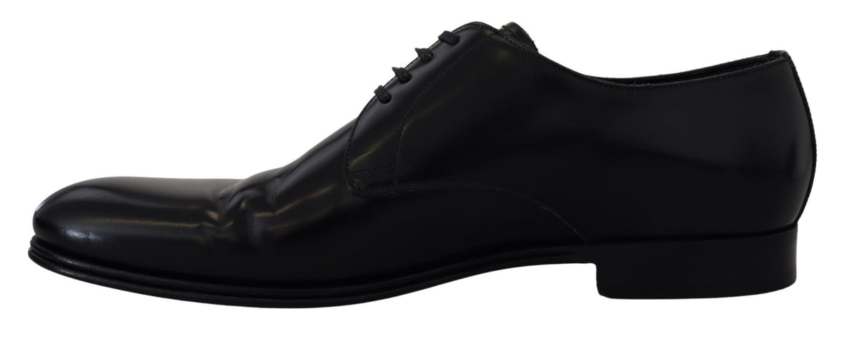 Indulge in the exquisite craftsmanship of Dolce & Gabbana's Black Leather Formal Dress Shoes, where timeless elegance meets luxurious comfort for the discerning individual.