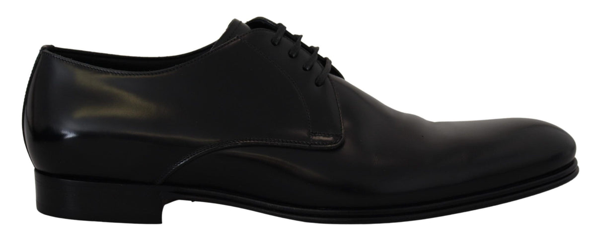 Indulge in the exquisite craftsmanship of Dolce & Gabbana's Black Leather Formal Dress Shoes, where timeless elegance meets luxurious comfort for the discerning modern gentleman.