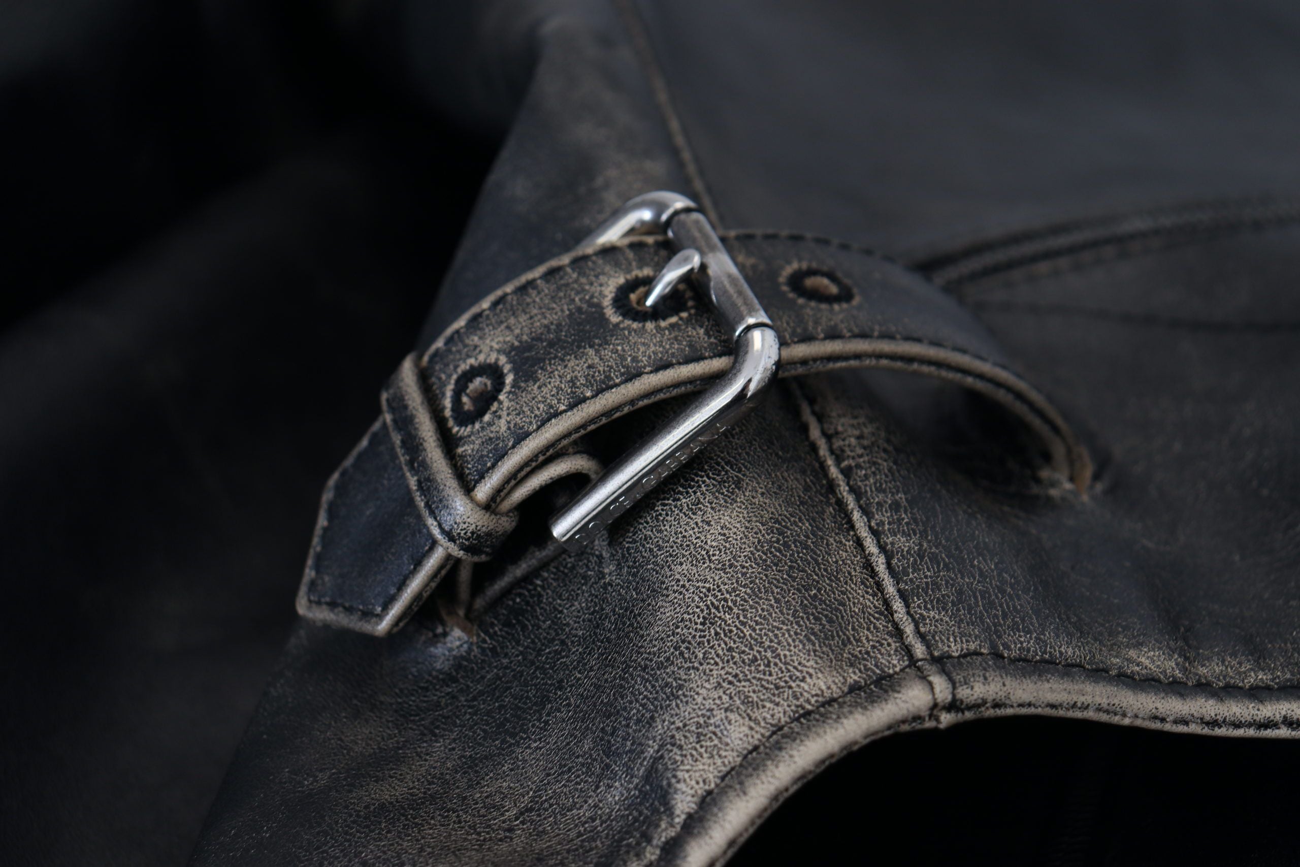 Indulge in the exquisite Dolce & Gabbana Black Leather Zipper Biker Coat Jacket, a luxurious statement piece crafted from premium leather, designed for the discerning individual who embodies sophistication and confidence.