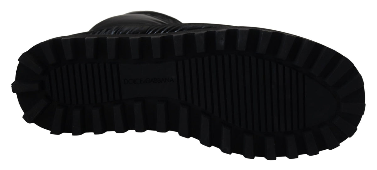 Elevate your winter wardrobe with Dolce & Gabbana Black Boots, crafted from luxurious polyester in Italy, embodying sophistication and timeless elegance for the discerning individual.