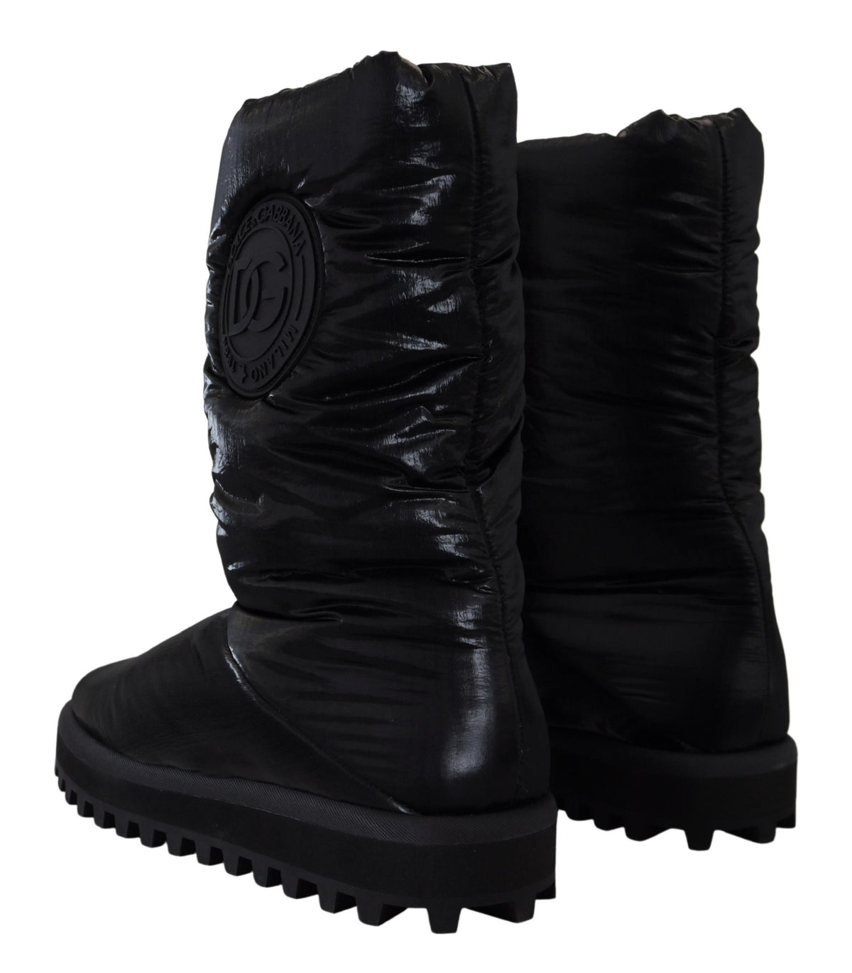 Elevate your winter wardrobe with Dolce & Gabbana's Black Padded Mid Calf Boots, crafted from luxurious polyester, merging exquisite Italian craftsmanship with timeless sophistication.