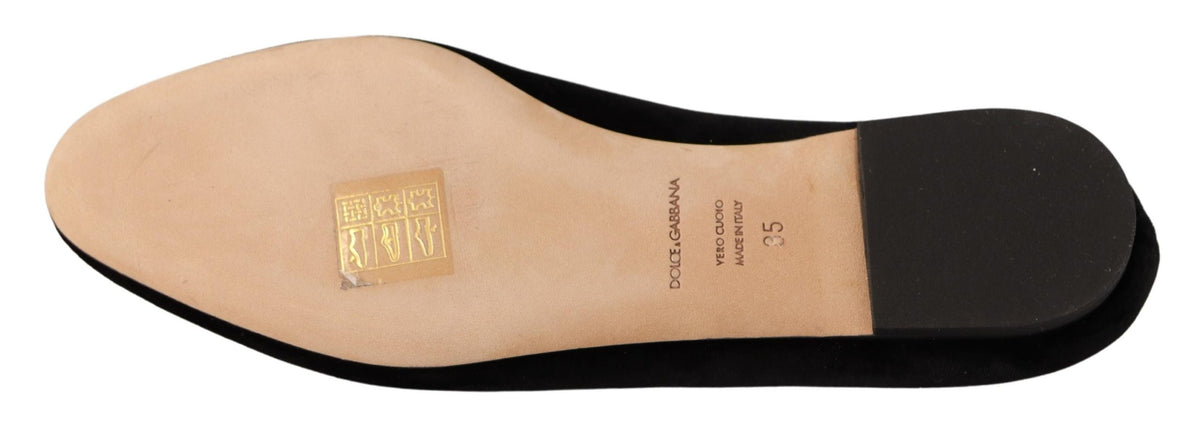 Step into unparalleled elegance with Dolce & Gabbana's Black DG Sacred Heart Patch Slip On Flats, crafted from luxurious leather for a timeless allure.