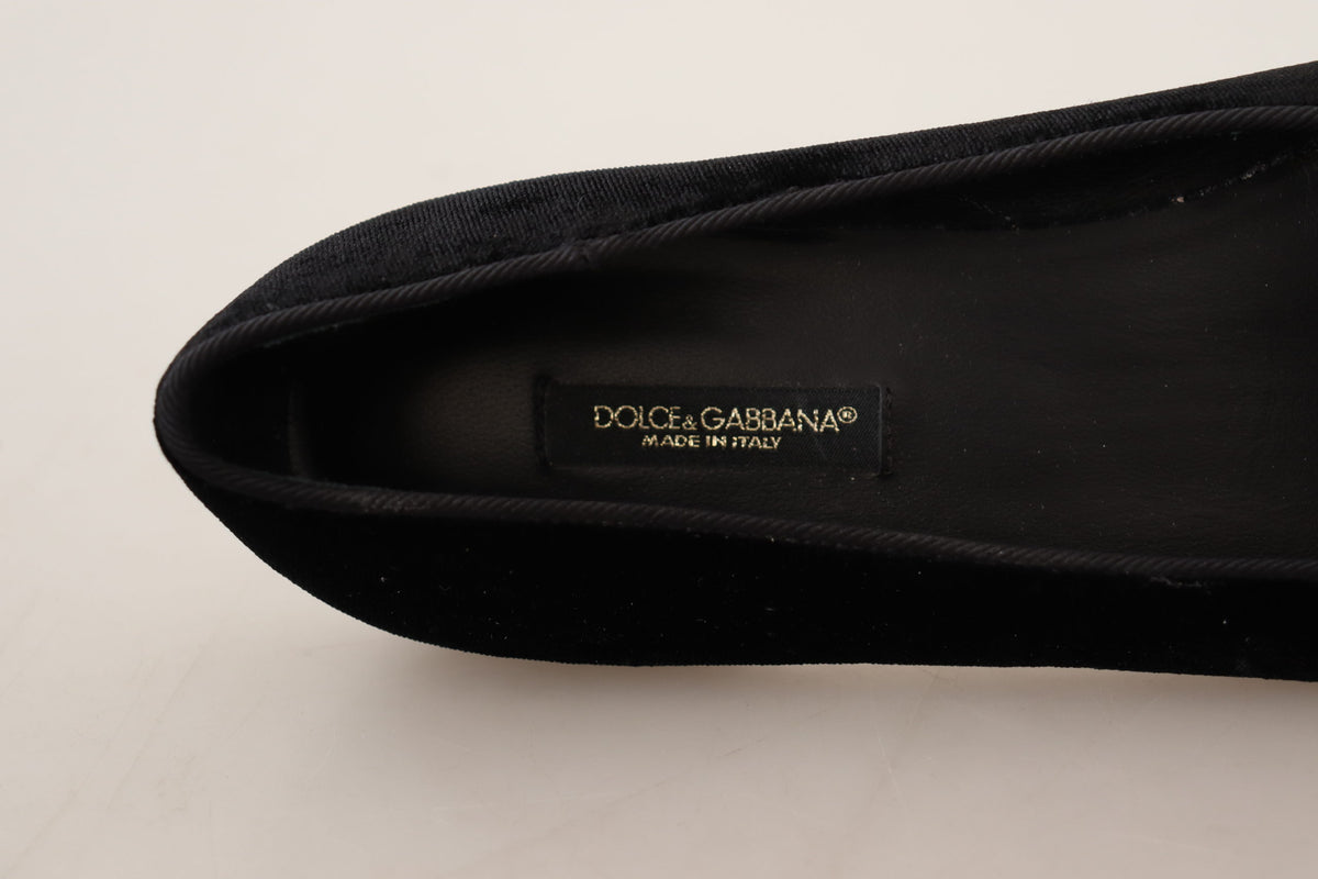 Elevate your style with Dolce & Gabbana's Black DG Sacred Heart Patch Slip On Flats, crafted from luxurious leather in Italy, embodying timeless elegance and sophistication.