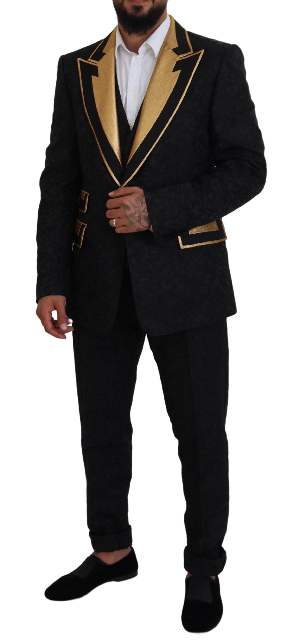 Experience the exquisite Dolce & Gabbana Black Gold Fantasy Tuxedo Slim Fit Suit, a luxurious blend of silk and acetate, crafted for timeless elegance and modern sophistication.